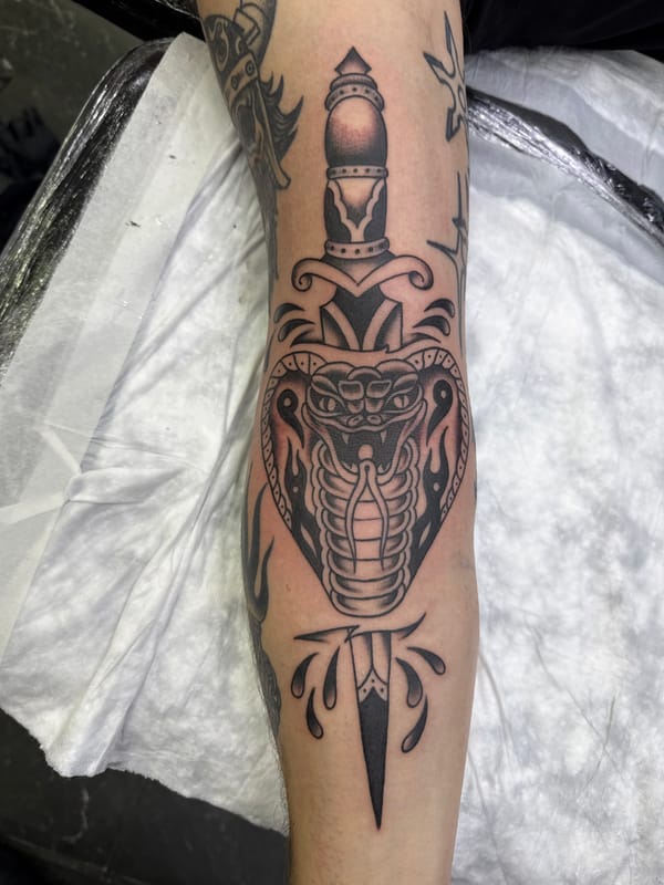 Snake and dagger tattoo observed in Moscow
