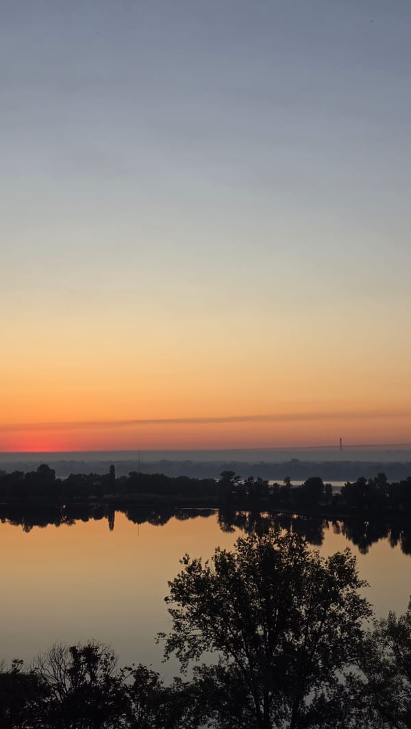 Dnipro River sunrise, Kyiv — soft light, mist, and bridges