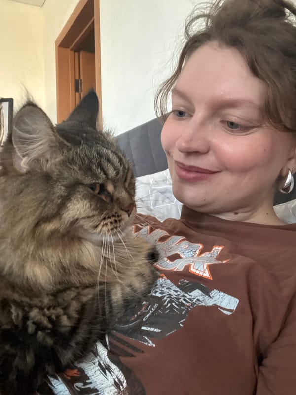 Woman holds tabby cat in Izhevsk, Russia