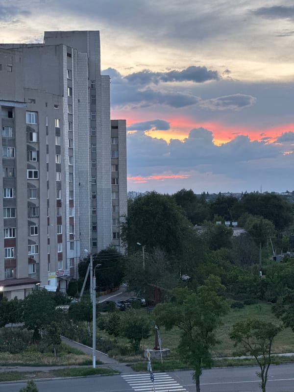 Sunset over Tiraspol's Soviet-era skyline, seen from a balcony