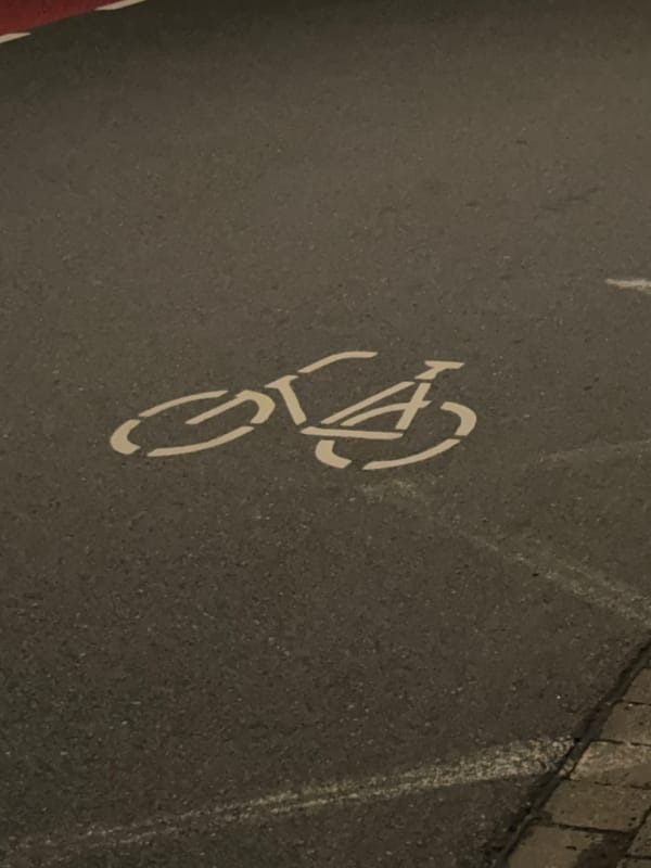 Nighttime urban cycling journey documented through street-level memories