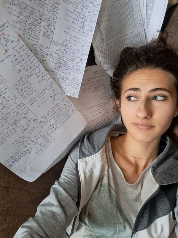 Student studies math equations on couch in Bulgaria