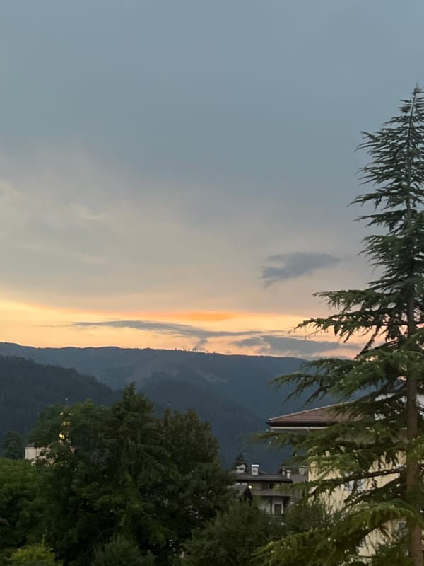 Dusk over Castello di Fiemme, solar panels and Alpine skyline