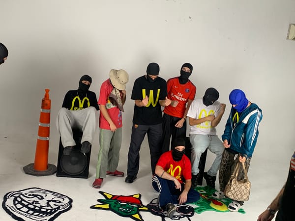 Masked person in tracksuit photographed in white room, Argentina