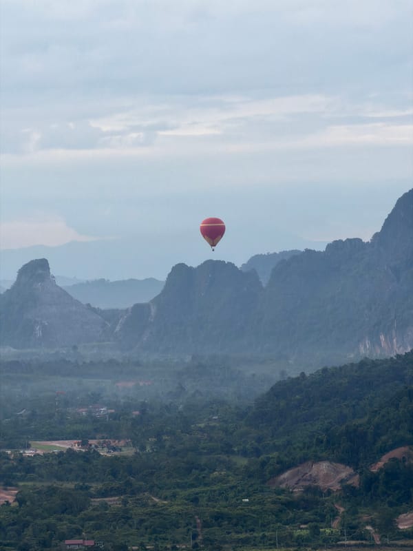 Hot air ballooning over Laos limestone karst country