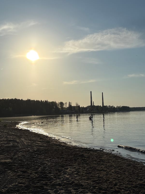 Child plays with ball on beach in Chaikovsky, Russia