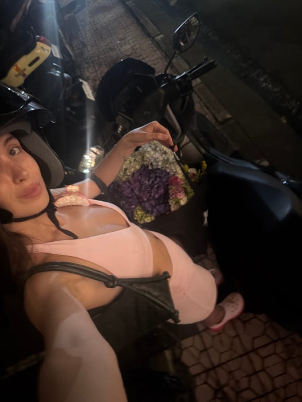 Tourist documents flower-adorned motorbike journey in Ubud