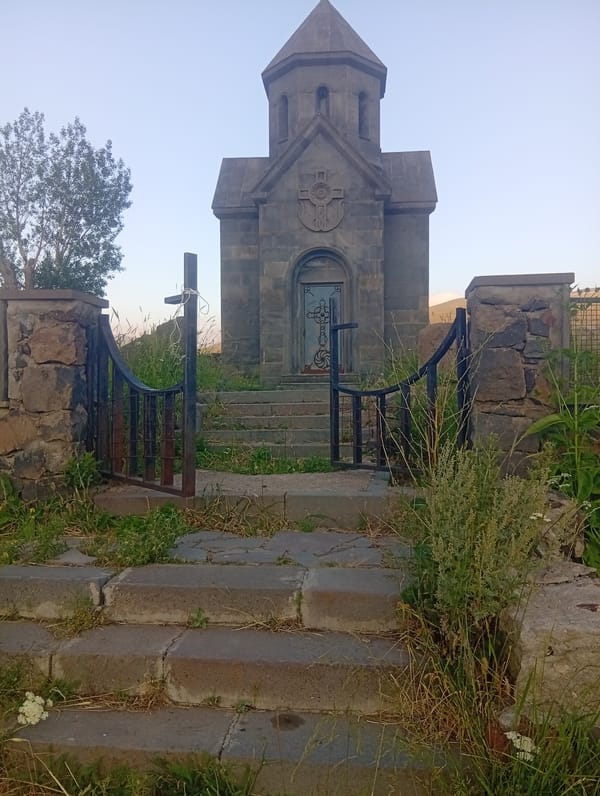 Stone chapel meets still water at Kechut Reservoir, Armenia