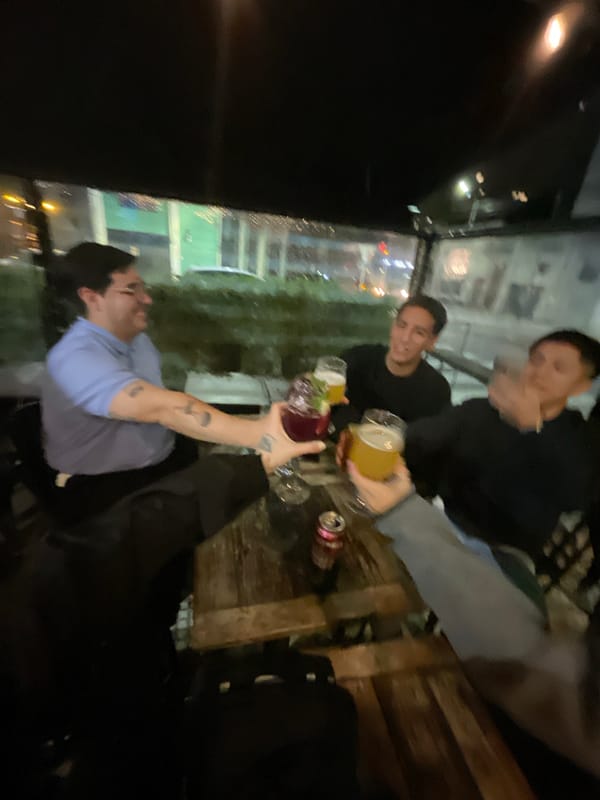 Late night gathering toasts drinks at Buenos Aires establishment