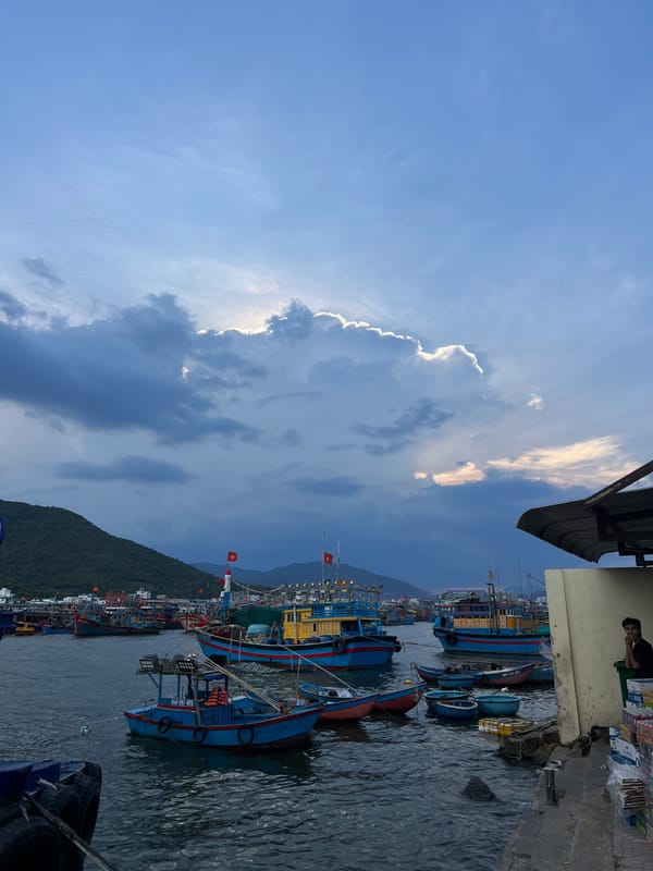 Fishing boats docked at pier in Nam Nha Trang Ward