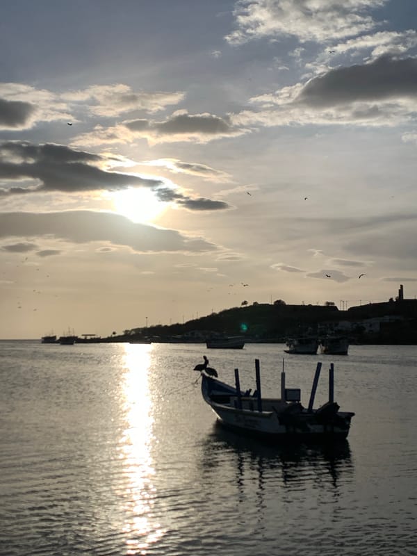 Sunset documented across Juan Griego harbor and streets