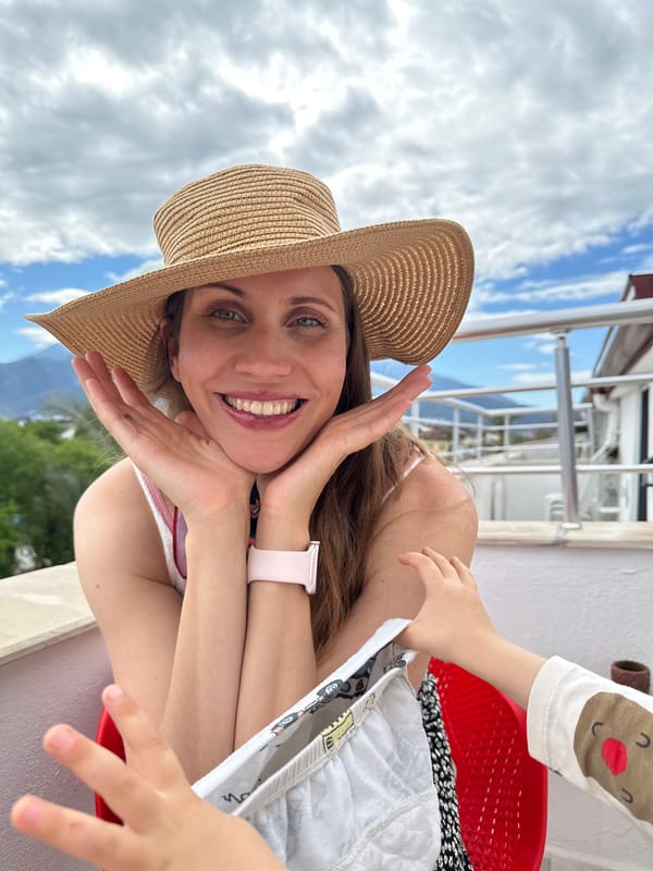 Family vacation selfies captured on Fethiye balcony overlooking mountains