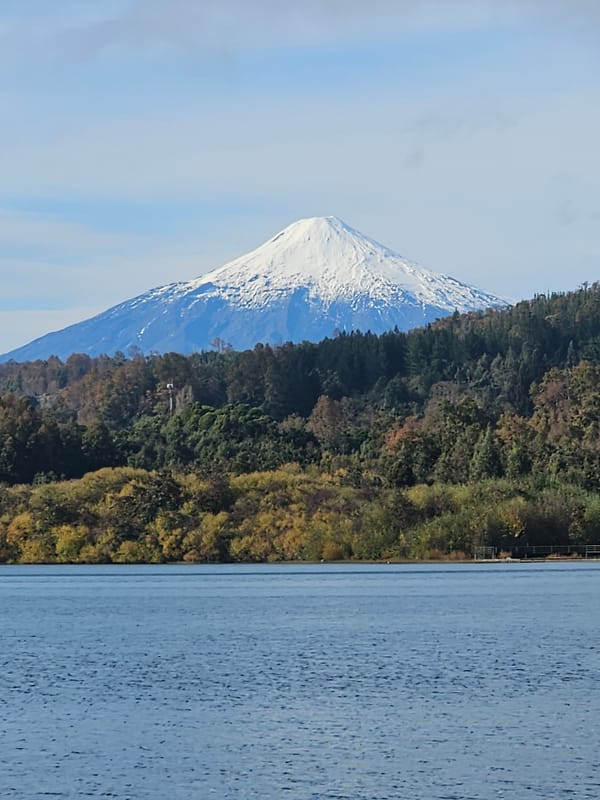 Daily life documented along Villarrica lakefront with volcano views