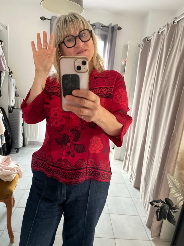 Woman takes mirror selfies in French bedroom
