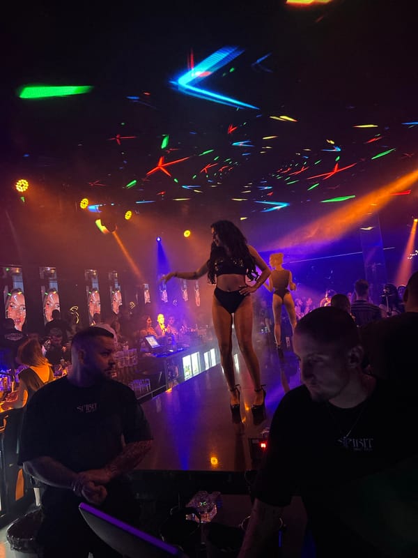 Nightclub scene with stage performances and drinks