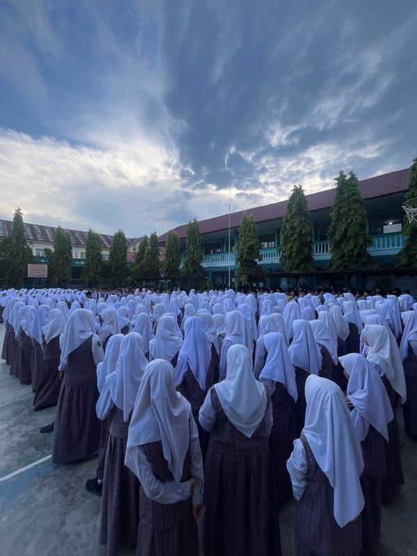 Students in formation and on the basketball court at a Lhokseumawe school