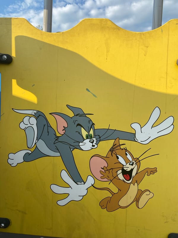 Tom & Jerry murals and a domed church under renovation in Petropavl