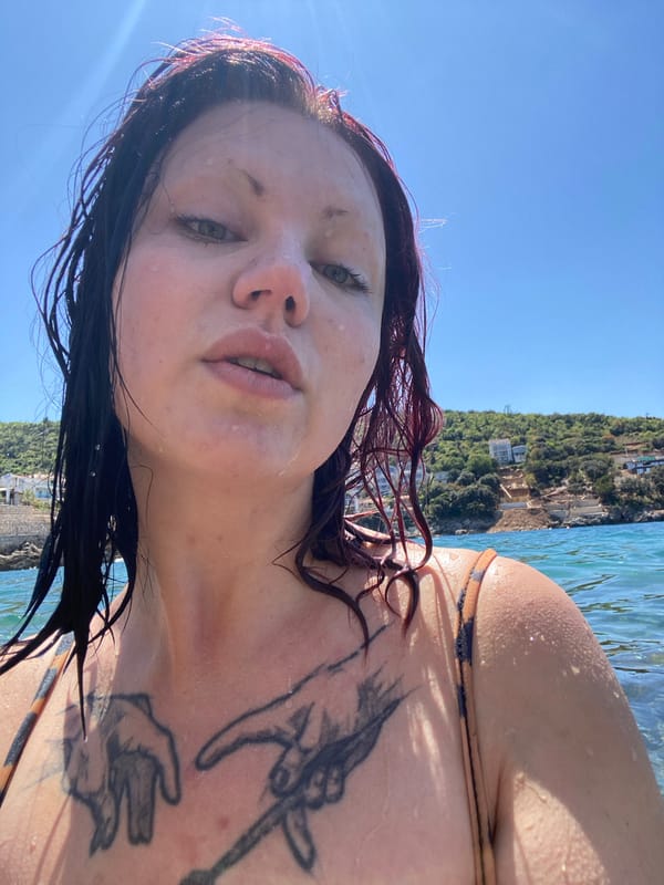 Woman enjoys sunny swim session at Montenegro waterfront