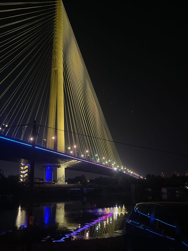 Ada Bridge pylon glowing at night, Belgrade