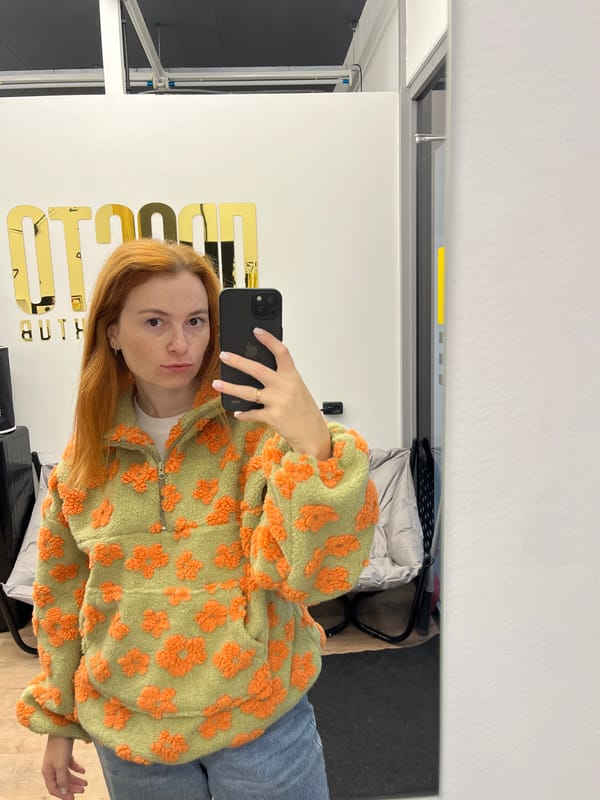 Mirror selfie session in a Chaikovsky interior, green floral jacket