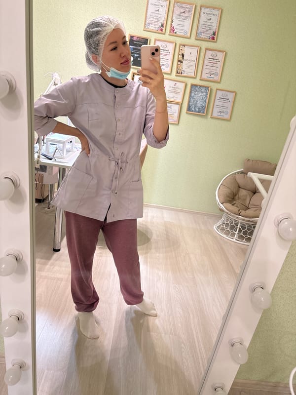 Medical worker takes selfies while child plays in Kostoryata