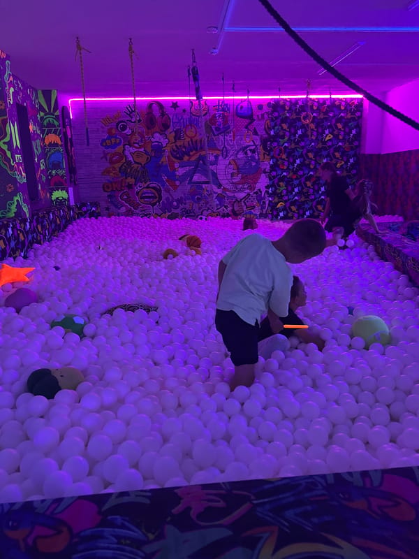 Afternoon at a neon-lit interactive kids' play venue
