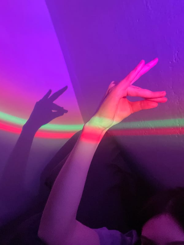 Person experiments with colorful lighting effects indoors in Moscow