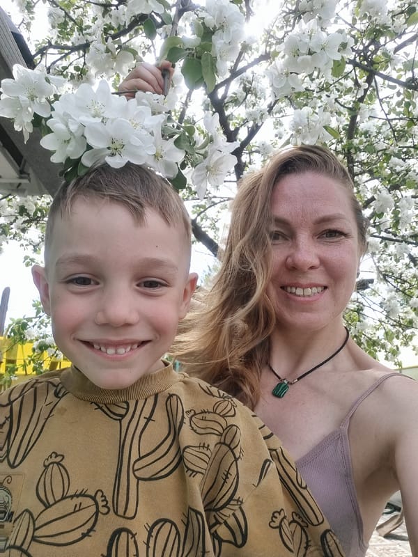 Mother and child enjoy spring morning in Chaikovsky, Russia