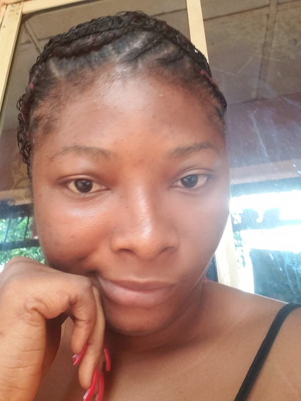 Woman with braids captured in contemplative pose, April 23