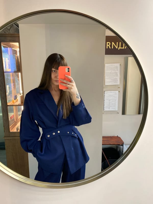 Woman takes multiple selfies in retail store mirrors, Votkinsk