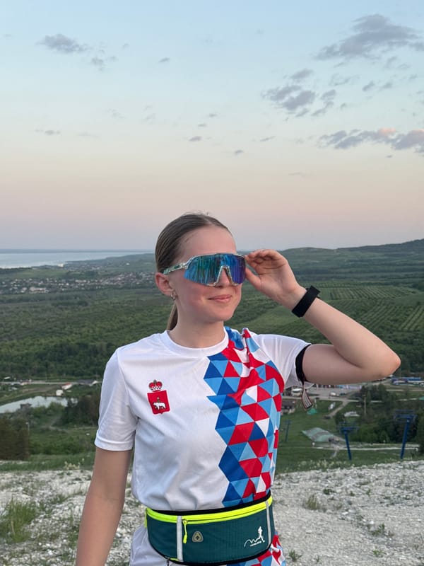 Woman views Khvalynsk landscape from rocky overlook