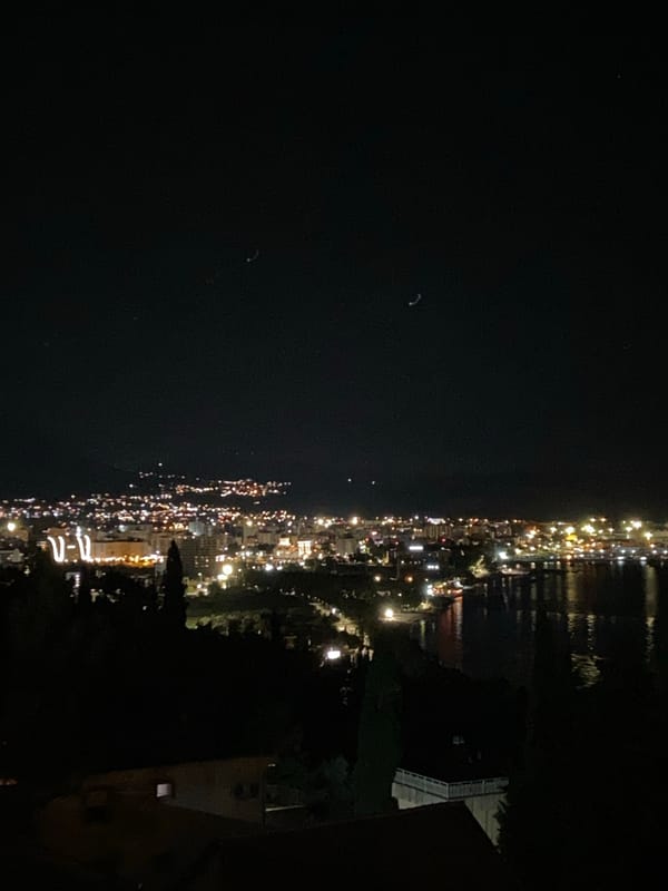 Nighttime panoramic views of illuminated Šušanj coastline
