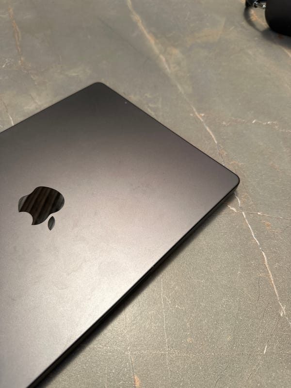 Closed MacBook photographed on stone surface in Bnay Zion