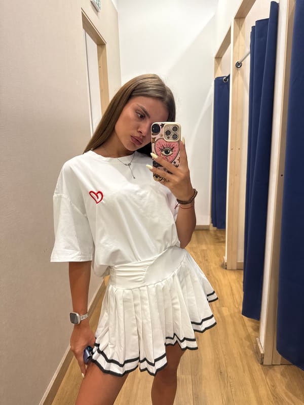 Fitting room try-on session in Plovdiv, white pleated skirt outfit