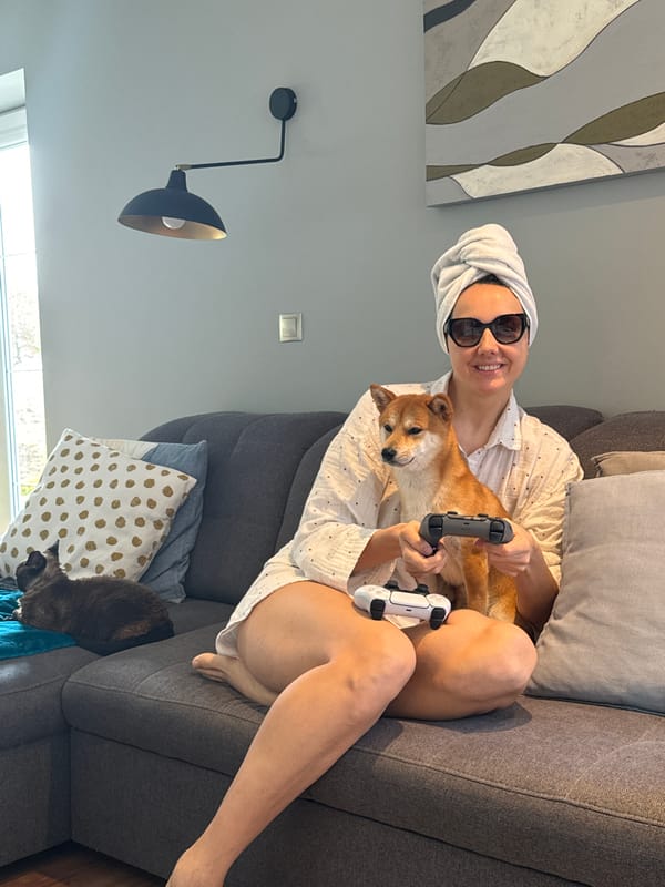 Woman with Shiba Inu holds game controllers in Latvia