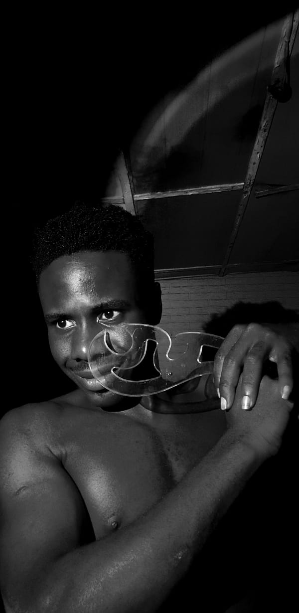 Creative self-portrait session in Narayi, Nigeria, with props and mood lighting.
