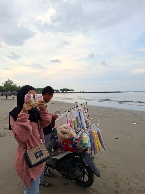 Beach ice cream vendor serves customers in Lhokseumawe