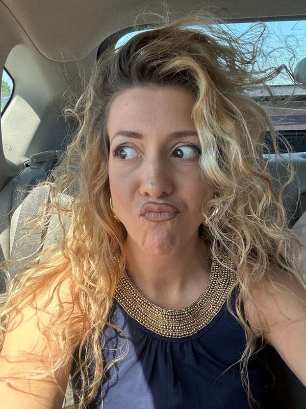 Woman takes selfie during scenic Miata drive near Muiden