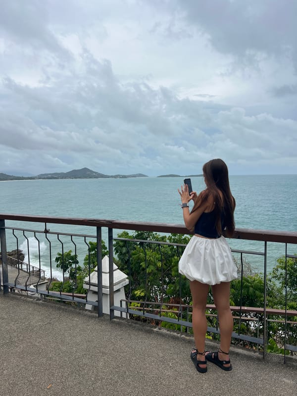 Woman observed on oceanfront patio in Baan Chaweng Noi