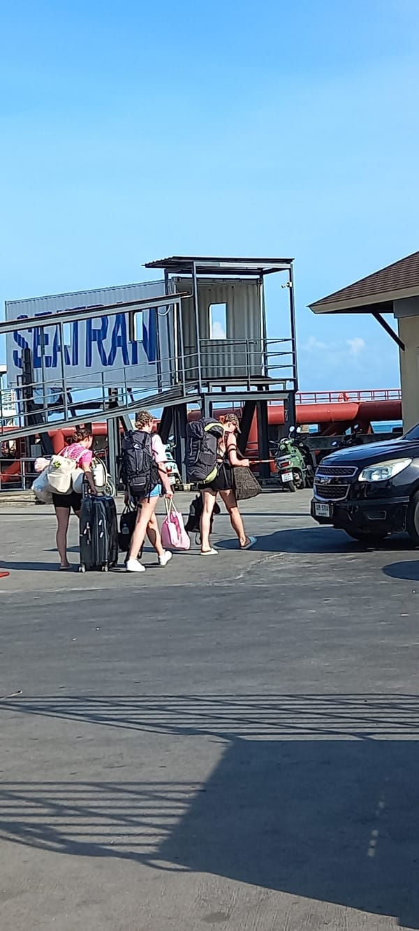 Ferry Terminal Activity and Coastal Views in Thong Sala