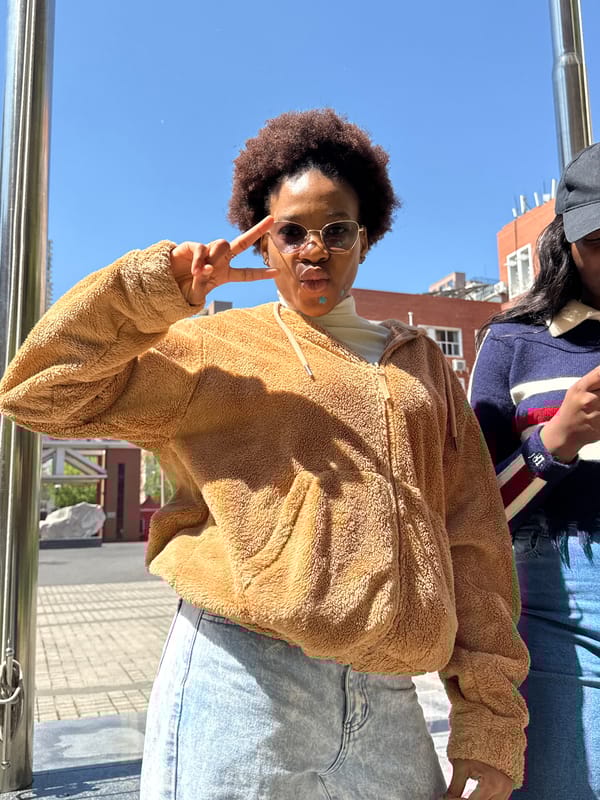 Person poses for photos in Daxing District morning