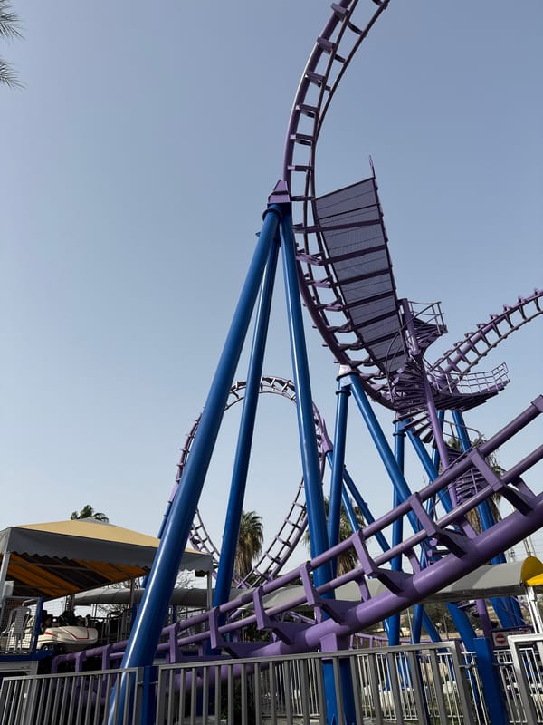 Tel Aviv amusement park with purple roller coaster observed