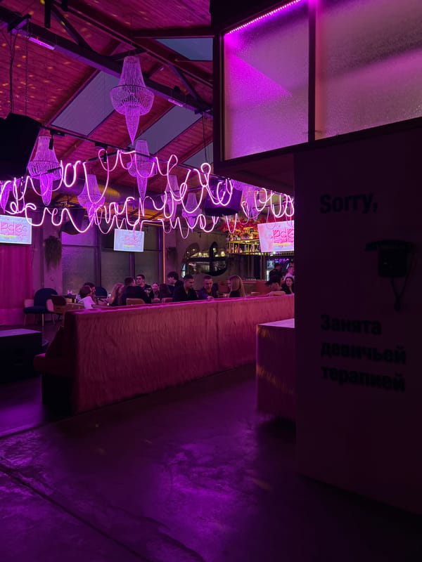 Neon-lit nightlife venue documented in Vladivostok evening hours