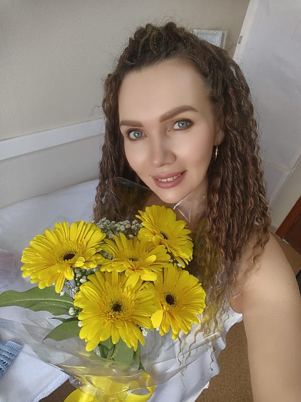 Woman spotted with flowers and strawberries in unknown location
