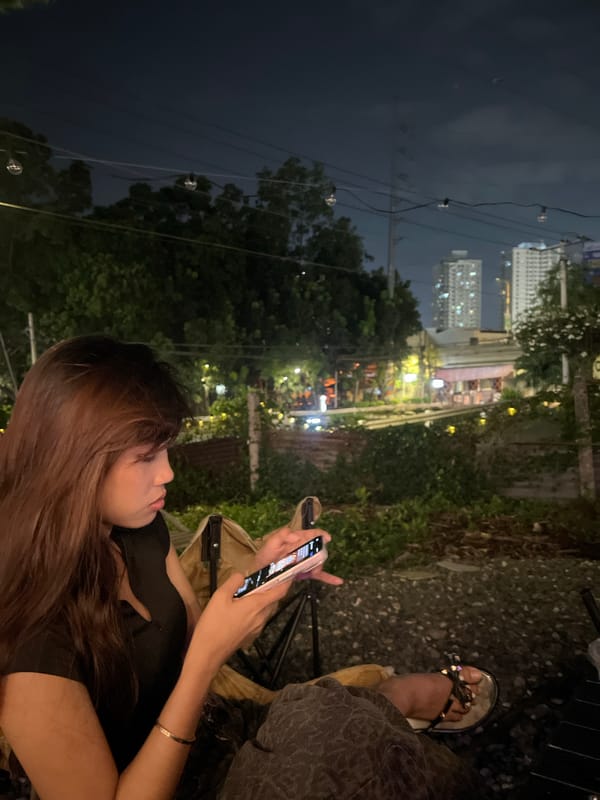 Nighttime drinks and phone time at a Davao outdoor café