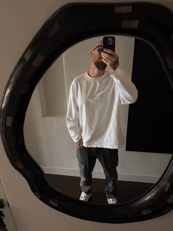 Man Takes Mirror Selfie in Los Angeles Indoor Location