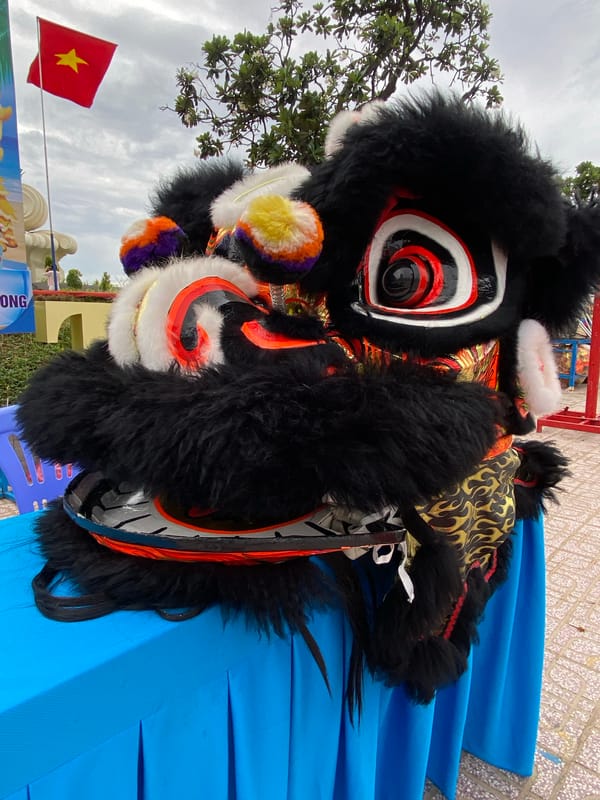 Lion dance performance and acrobatics on the streets of Nha Trang