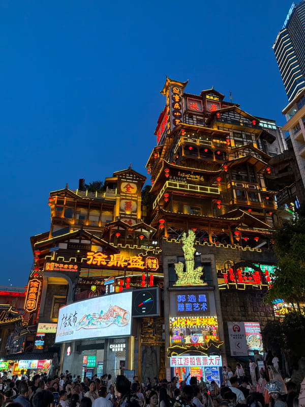 Traditional costume photography at a Chongqing night landmark