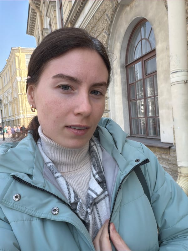 Tourist documents Saint Petersburg architecture and selfies during morning visit
