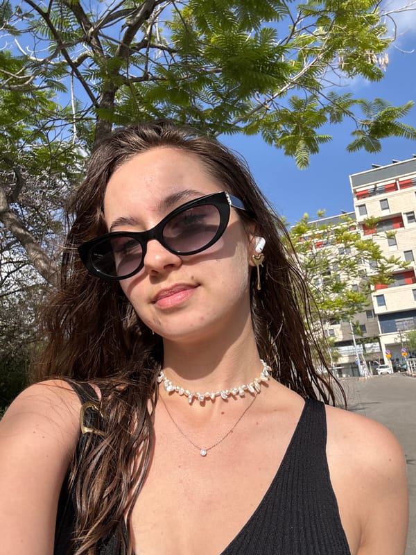 Woman with guitar hair clip photographed outdoors in Tel Aviv